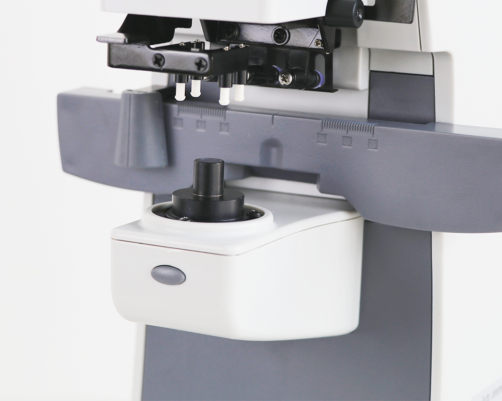 Automatic digital lensmeter — close-up of lens support and measurement assembly