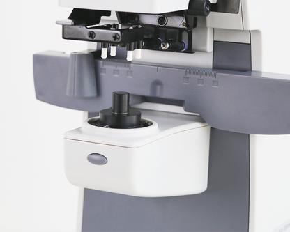 Automatic digital lensmeter — close-up of lens support and measurement assembly